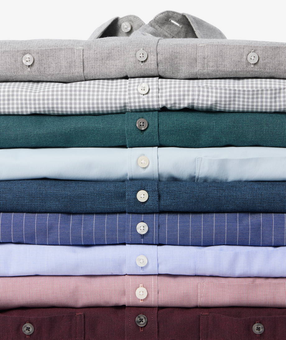 Collection of UNTUCKit button downs in various colors. 