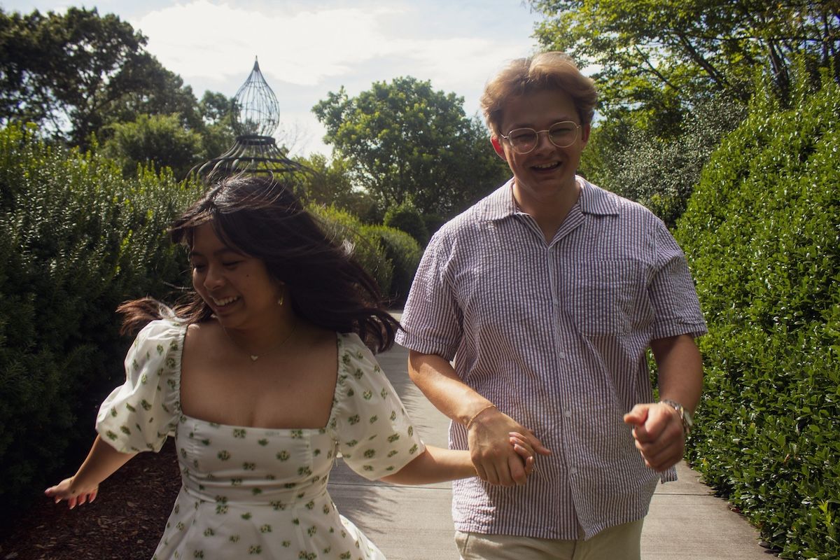engaged couple running north carolina arboretum