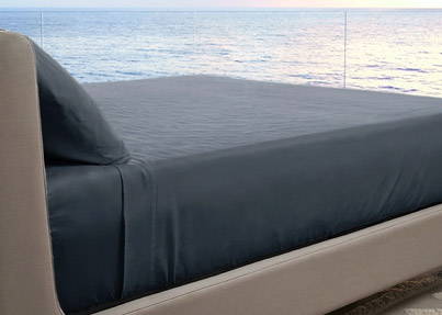Dark gray resort bamboo sheets on a bed