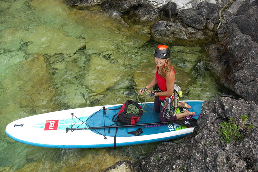 climbing from a paddleboard