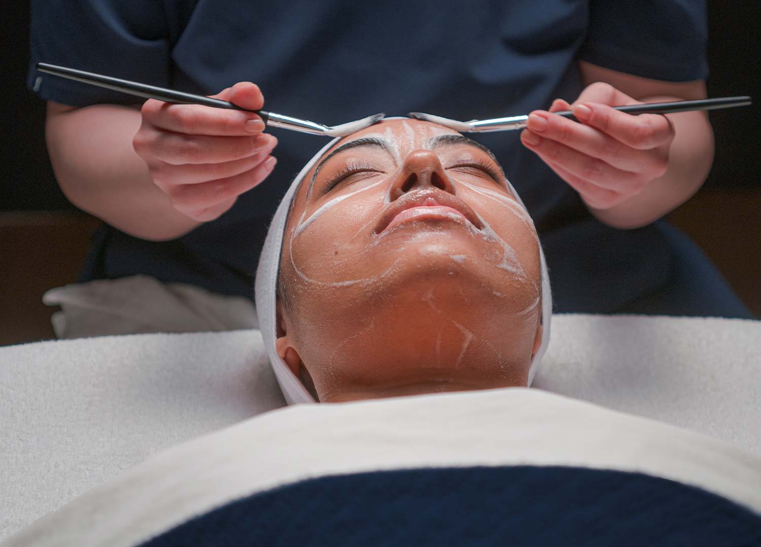 Woman getting pure results facial