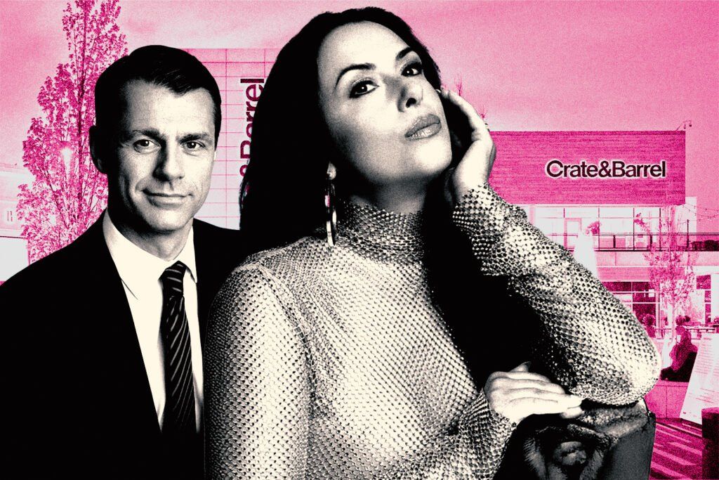 Black-and-white editorial-style image of a man in a suit standing beside a woman wearing a shimmering high-neck top and hoop earrings, posed in front of a Crate & Barrel storefront against a pink background. The storefront signage reads 