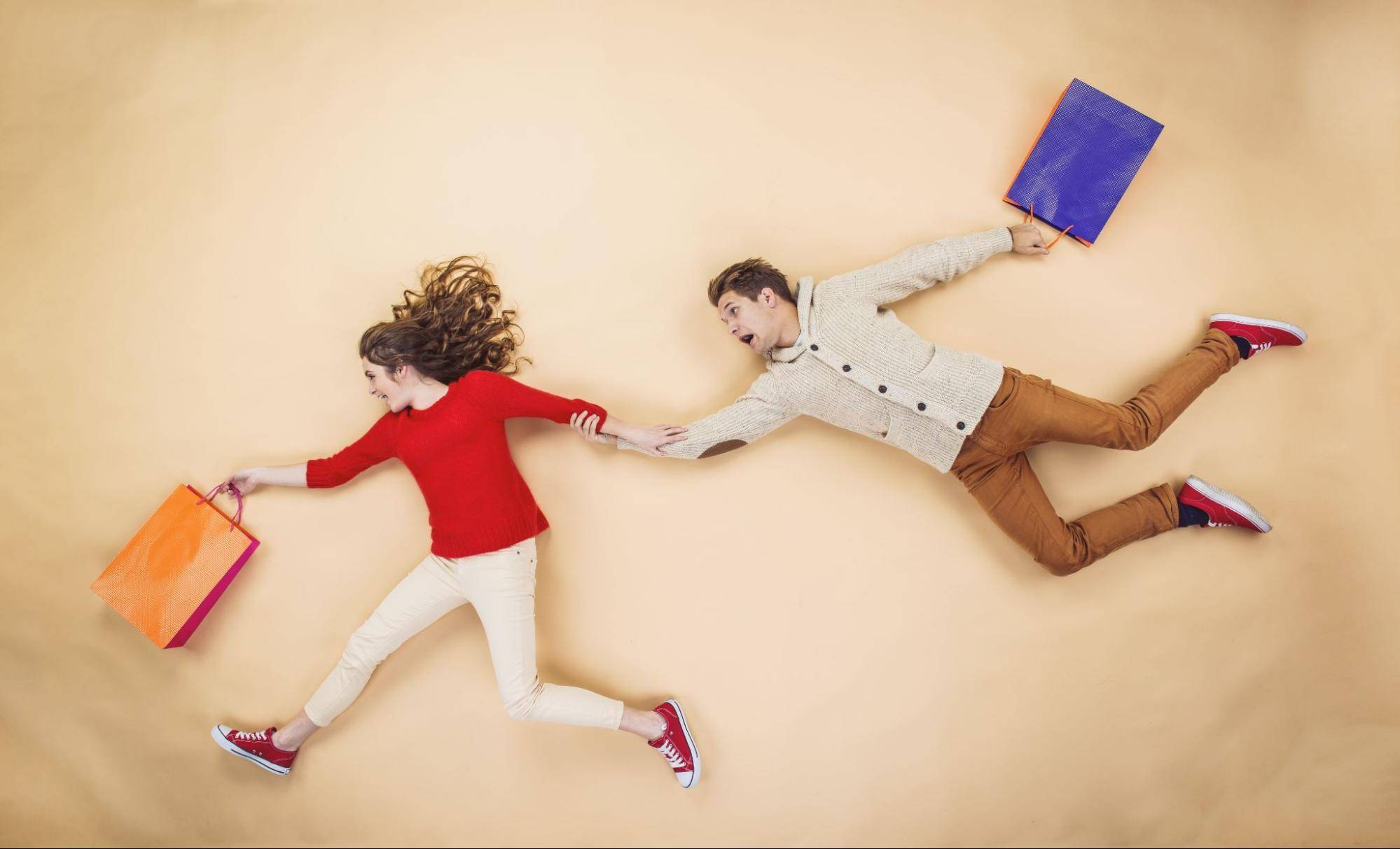 man and woman with shopping bags