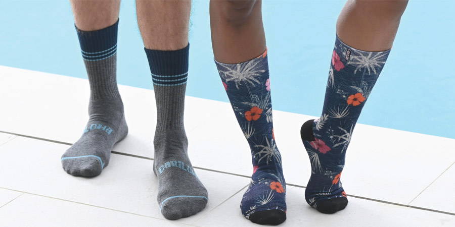 man and woman wearing bamboo socks by a pool