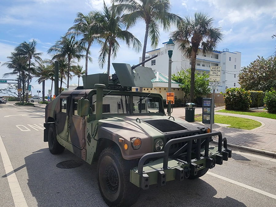 Woodland camouflage M1045 A2 Humvee brush guard roof turret antenna tropical street palm trees valet parking Jack L. Outlaw 228H train horn kit featured customer install gallery photo 1