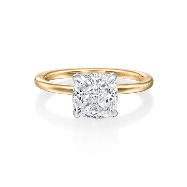 Gold ring with a square diamond centerpiece.