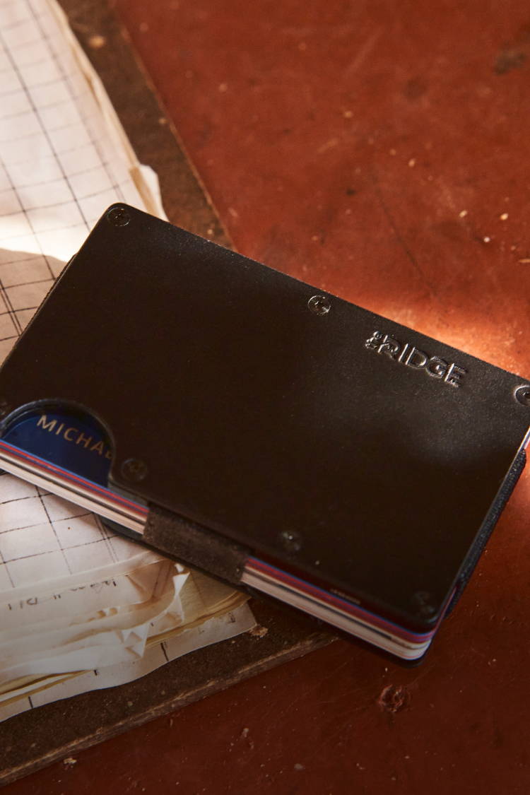 Midnight Black Ridge leather wallet on wooden top