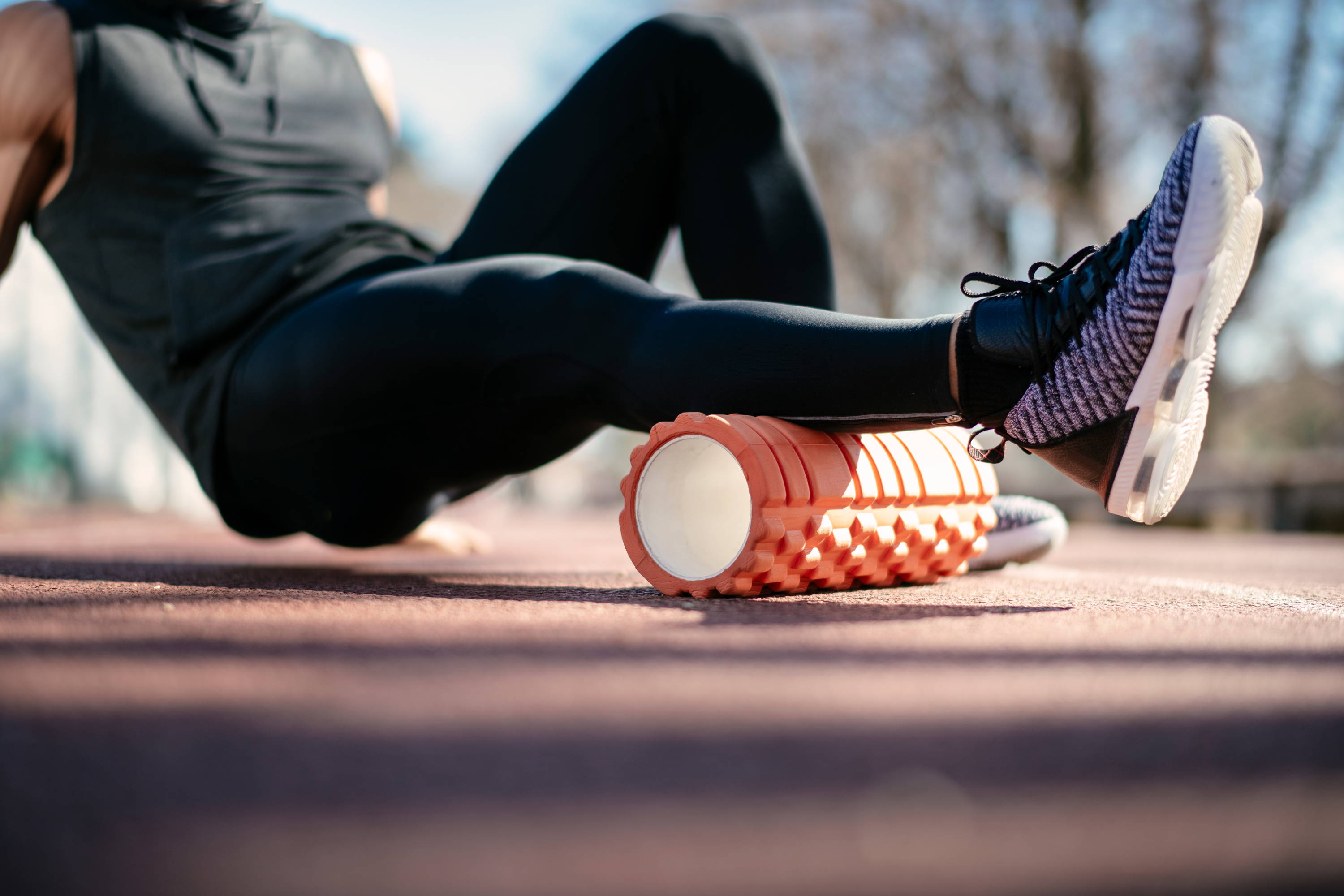 man using foam roller