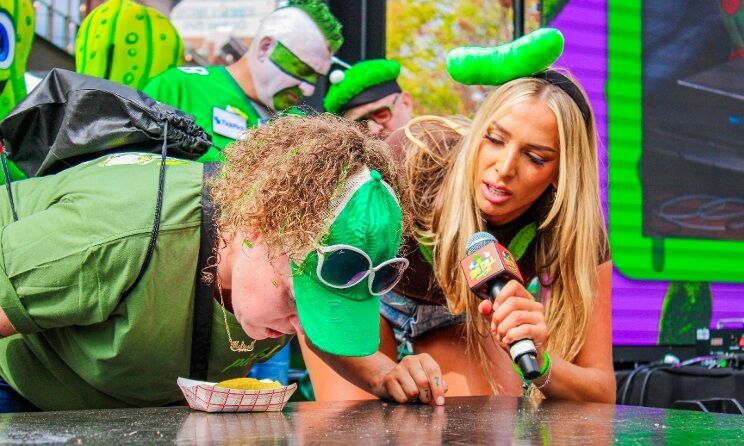 Contestant competing in the Pickle Up! game show at The Big Dill® pickle festival 2025 in Baltimore Maryland