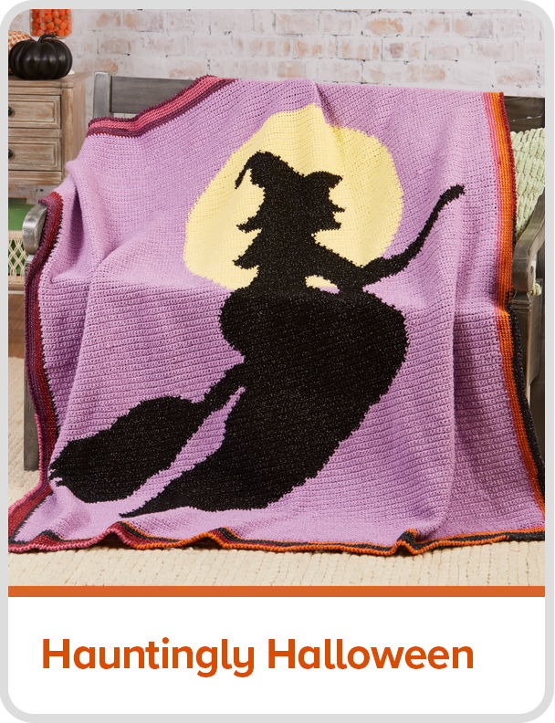 A Halloween-themed blanket featuring a witch silhouette against a moonlit background. Text: Hauntingly Halloween
