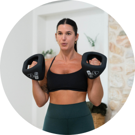 Person exercising with YBells in a fitness environment.
