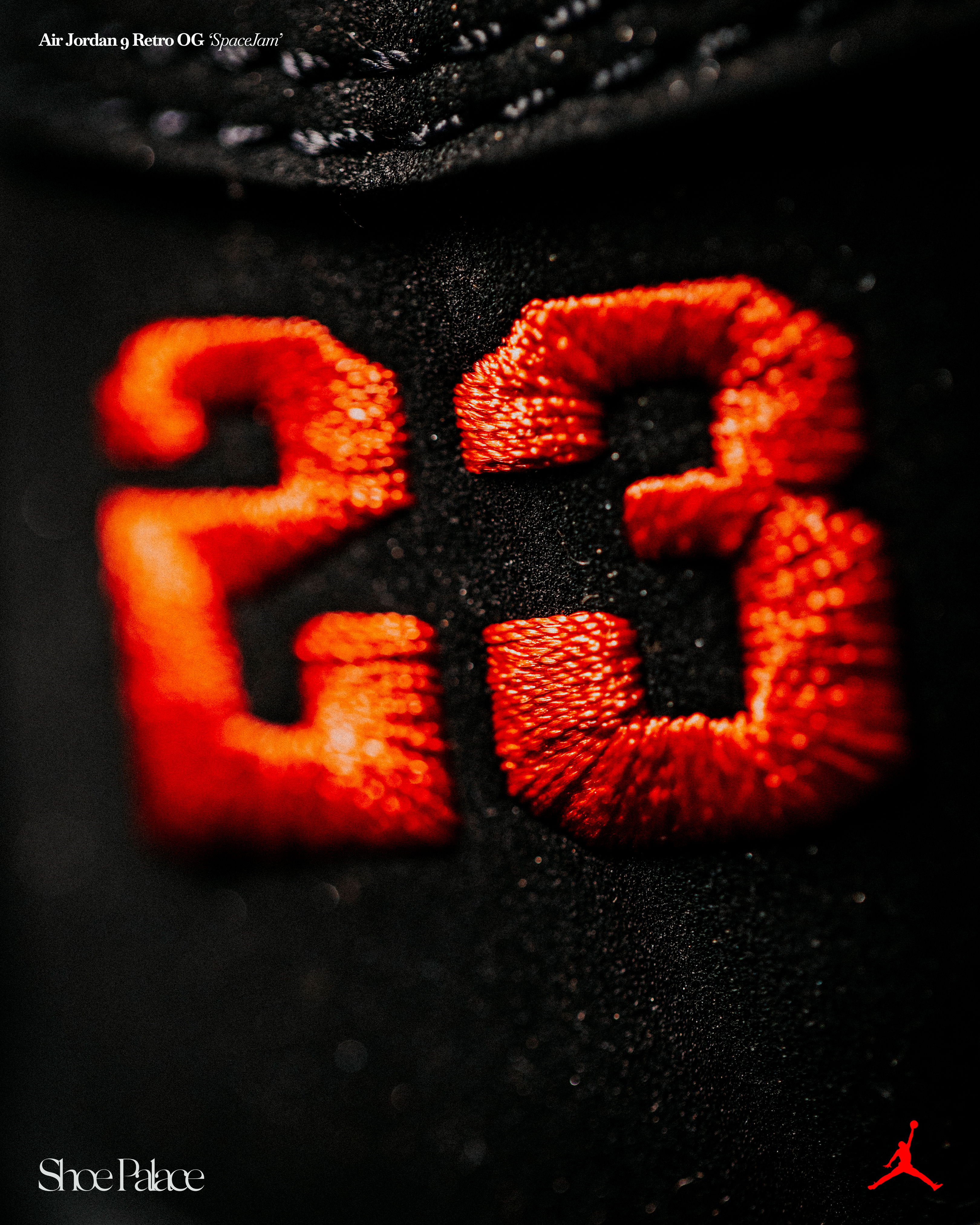 Close-up of a black fabric with embroidered orange 