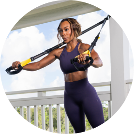 Person exercising with resistance bands outdoors.