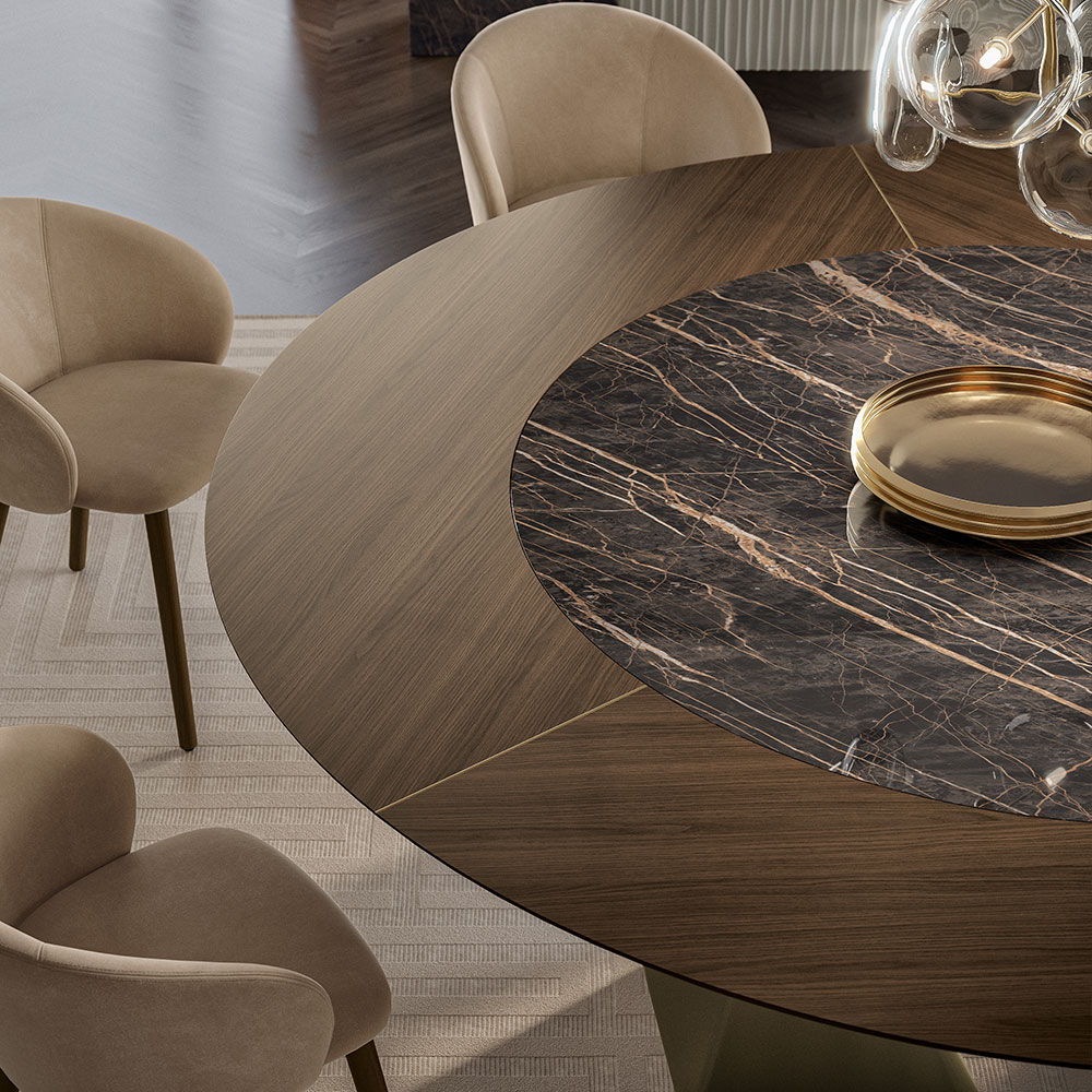 Round marble topped dining table with wooden surround. Luxury dining tables on display in Norwich.