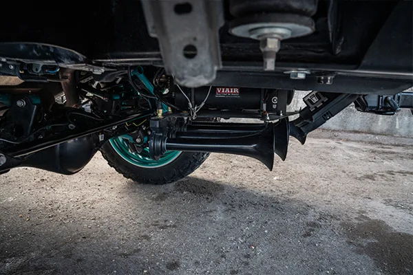 VIAIR compressor two train horns black mounting bracket teal wheel rear axle Kealoha's 2019 4Runner Conductor's Special 244K gallery photo 3