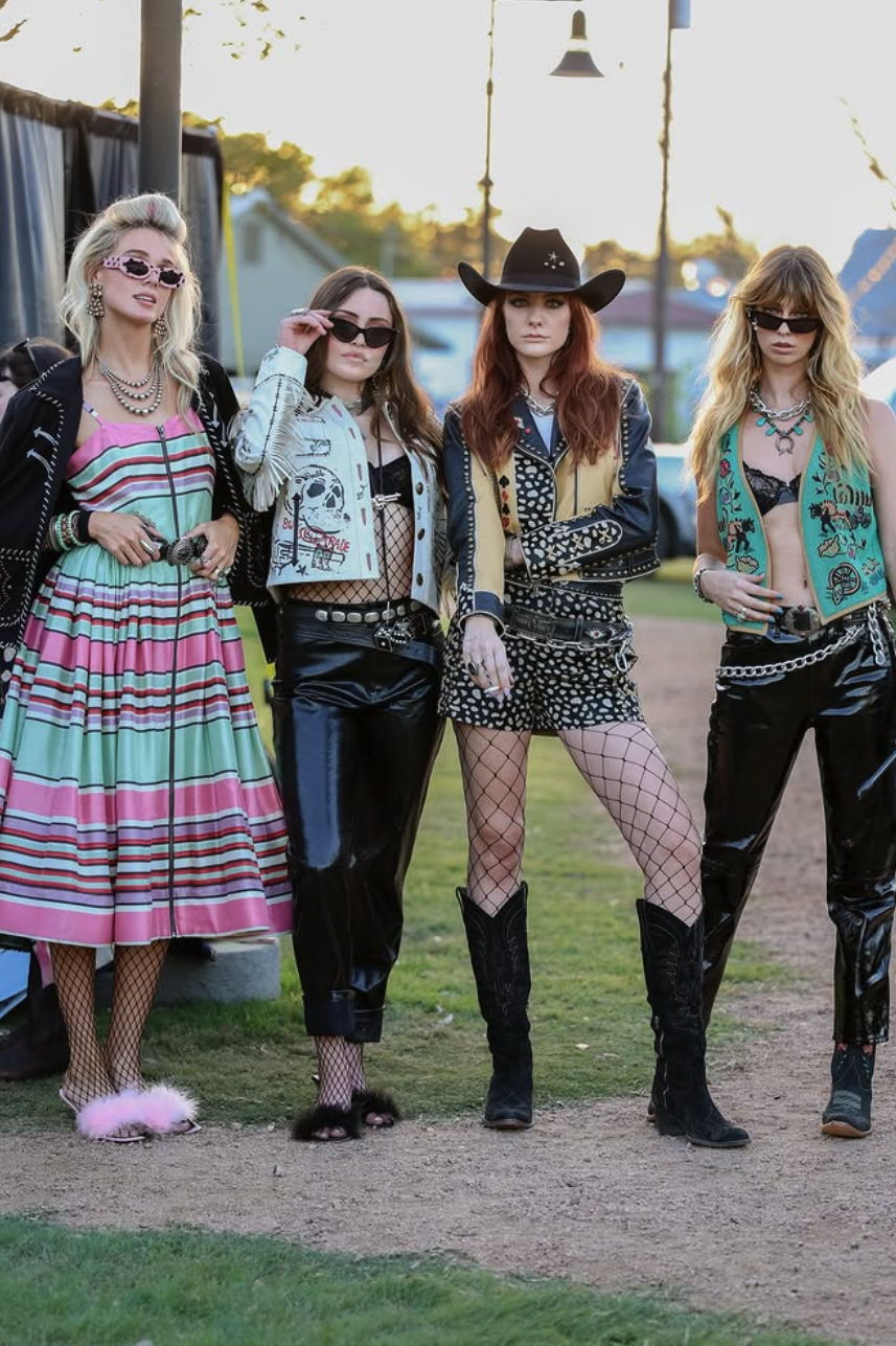Models styled head to toe in Double D Ranch's Cowboy Graffiti collection waiting to walk the runway in Round Top, Texas.