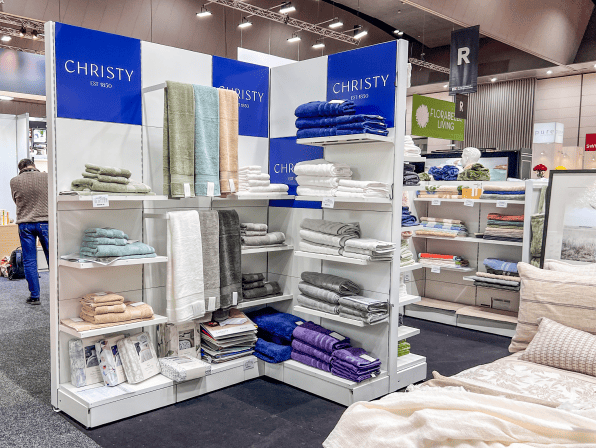 Display of various textiles and towels in a retail setting.