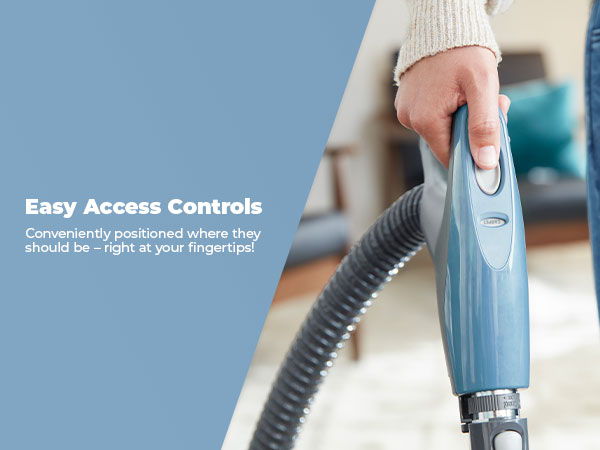 Person holding a vacuum cleaner with easy access controls.