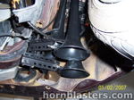 Wheel well two black train horns bracket mount wiring 1999 Mitsubishi Eclipse Shocker XL customer install gallery photo 5