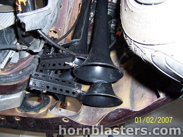 Wheel well two black train horns bracket mount wiring 1999 Mitsubishi Eclipse Shocker XL customer install gallery photo 5