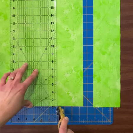 Cutting two 3 ½” x 18 ½” fabric strips