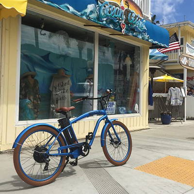 An electric beach cruiser on the boardwalk.