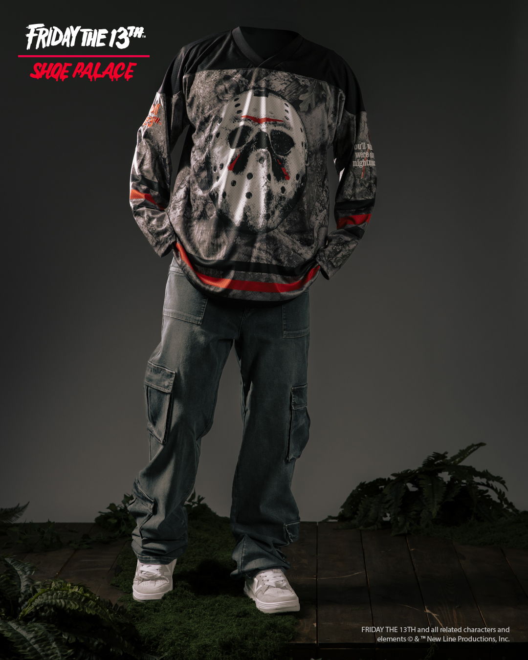 A person wearing a Jason Voorhees jersey and cargo pants, standing against a dark background.