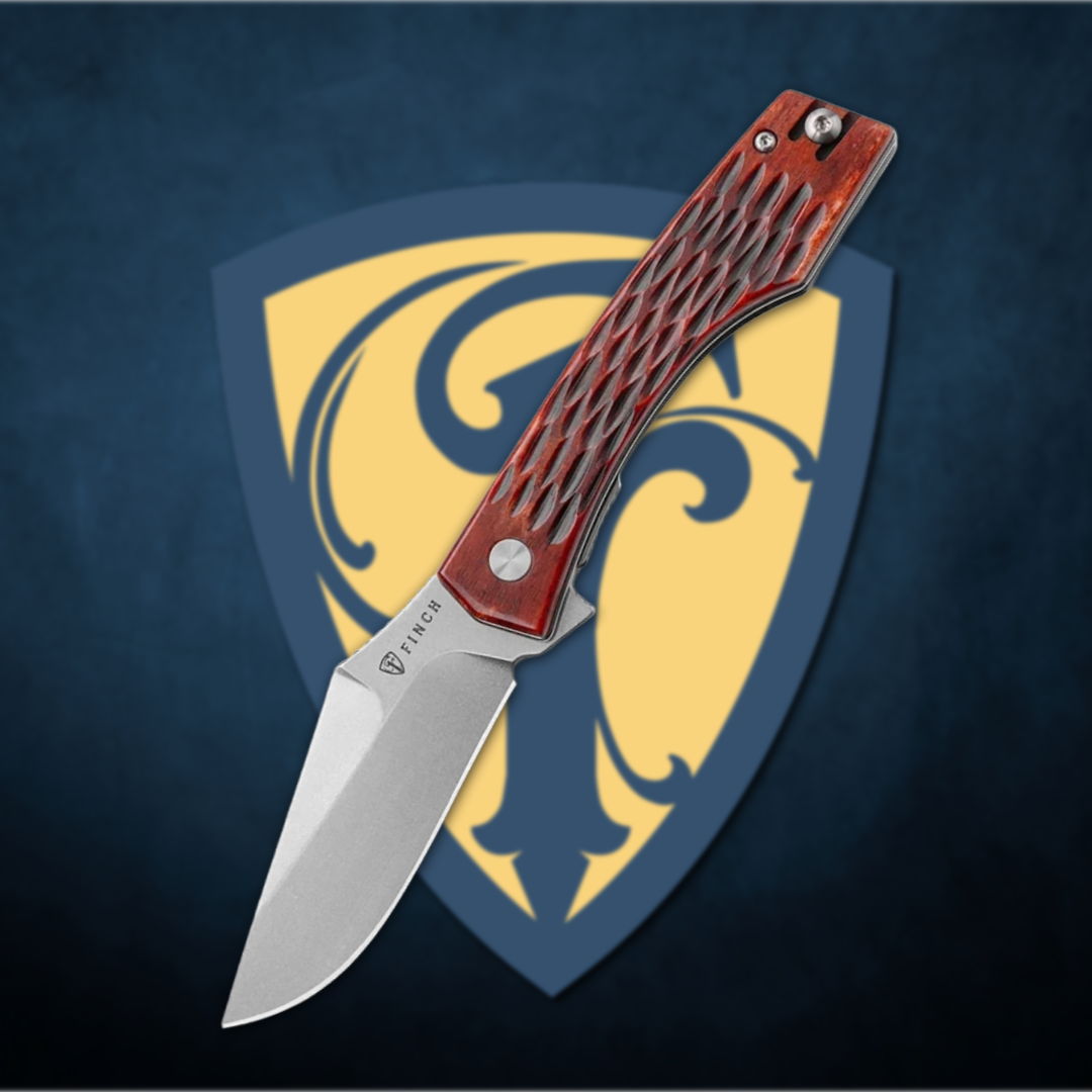 A knife with a red handle on a shield background.