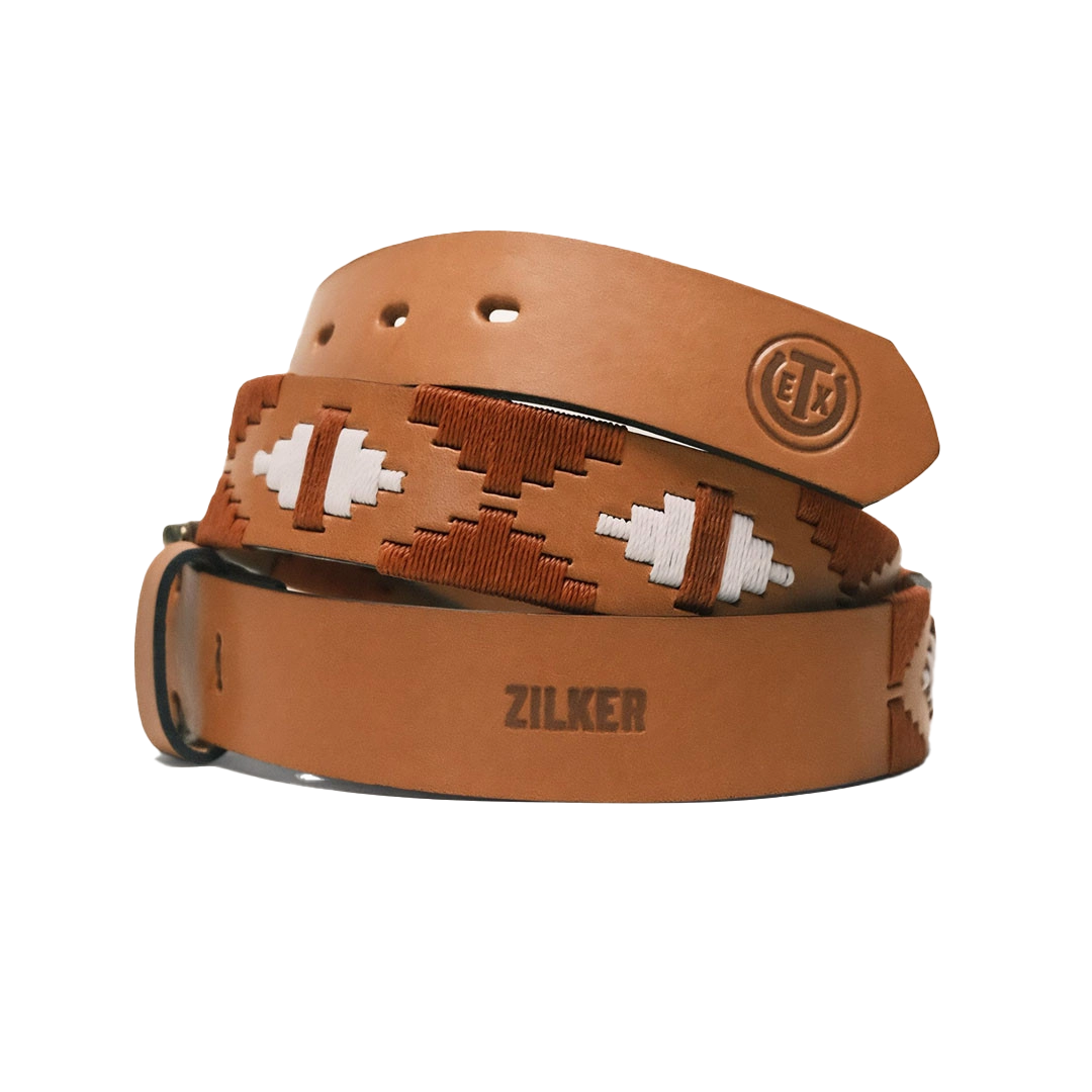 A stacked leather belt with decorative patterns and the brand name 