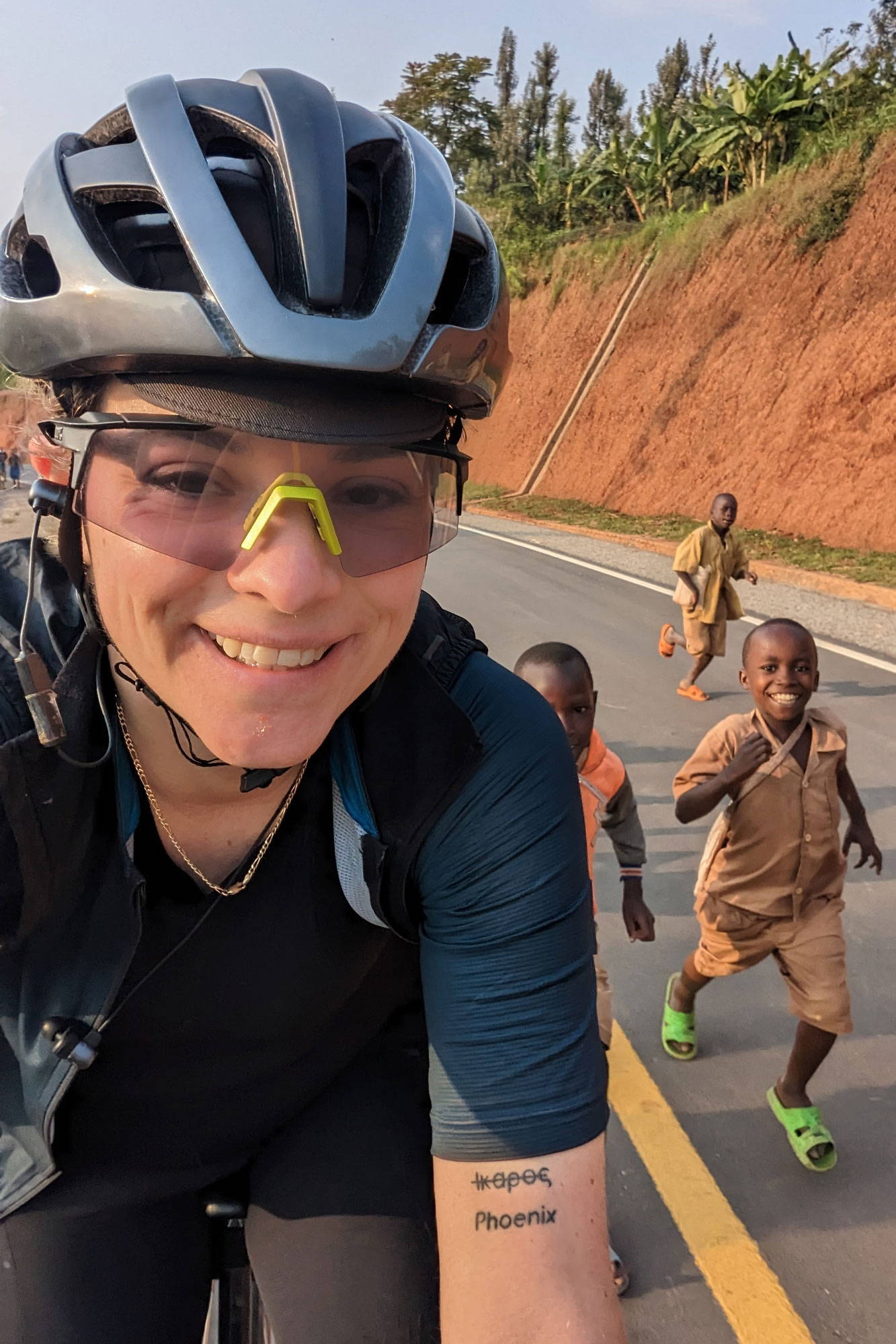 Lisa riding past a group of kids