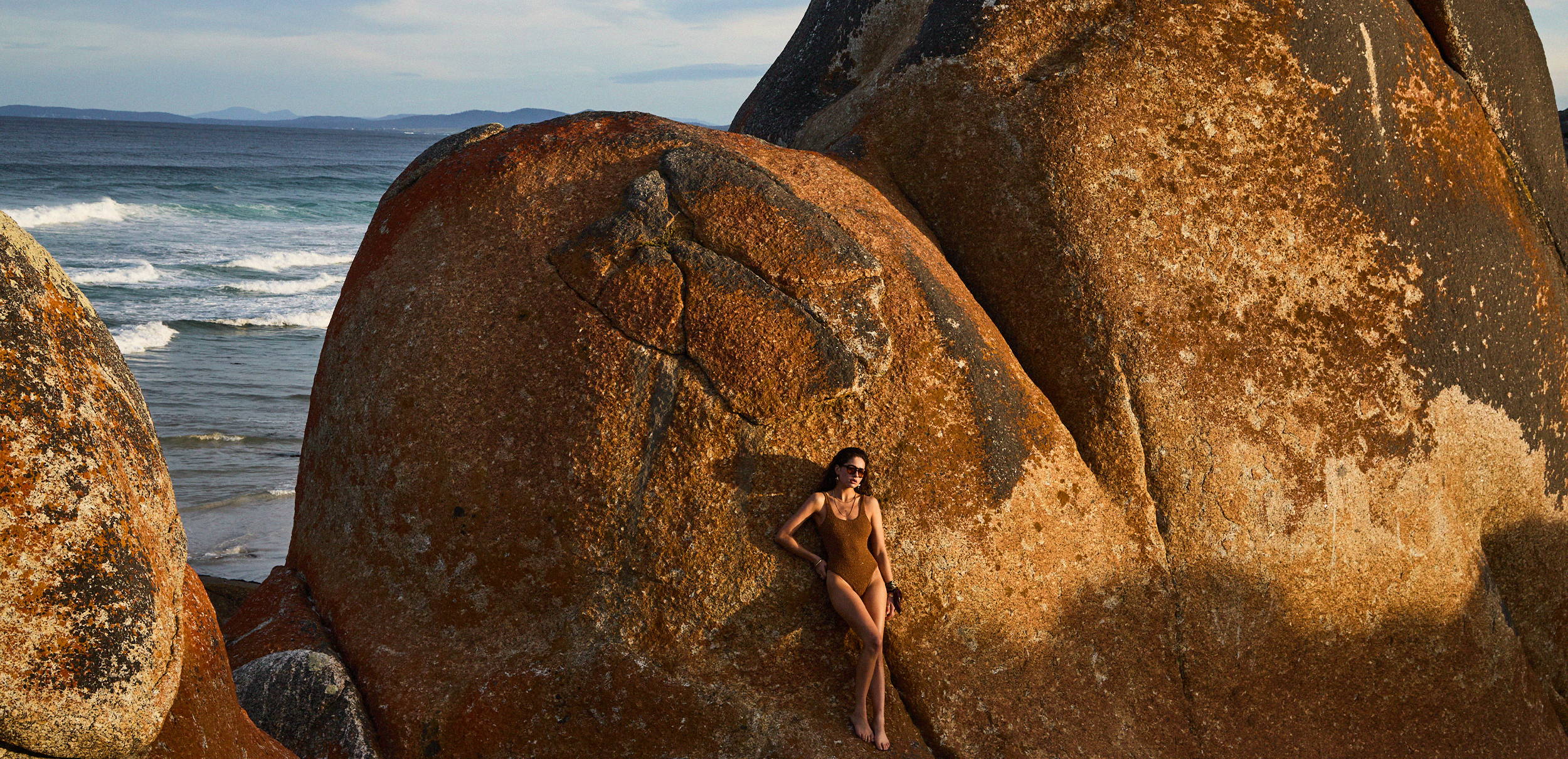 THE UPSIDE new swim. Shop now. Model wears the brown tobacco Sands Claudina One Piece.