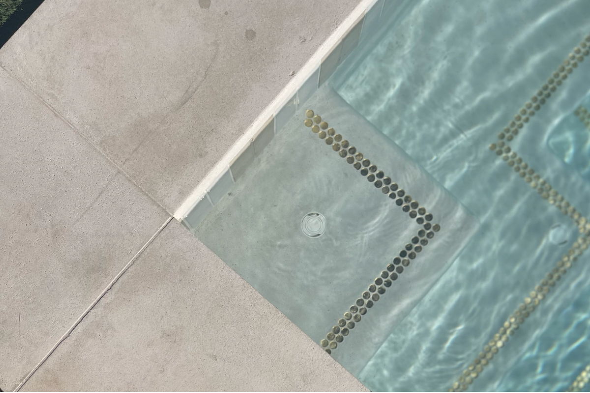 Modern natural pool coping and luxury tile for pools.