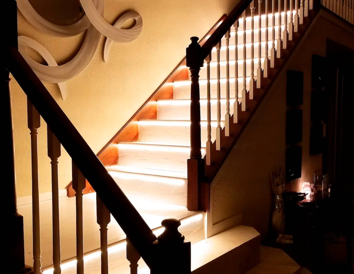 Stairway lighting with LED strip lights under the groove or lip 