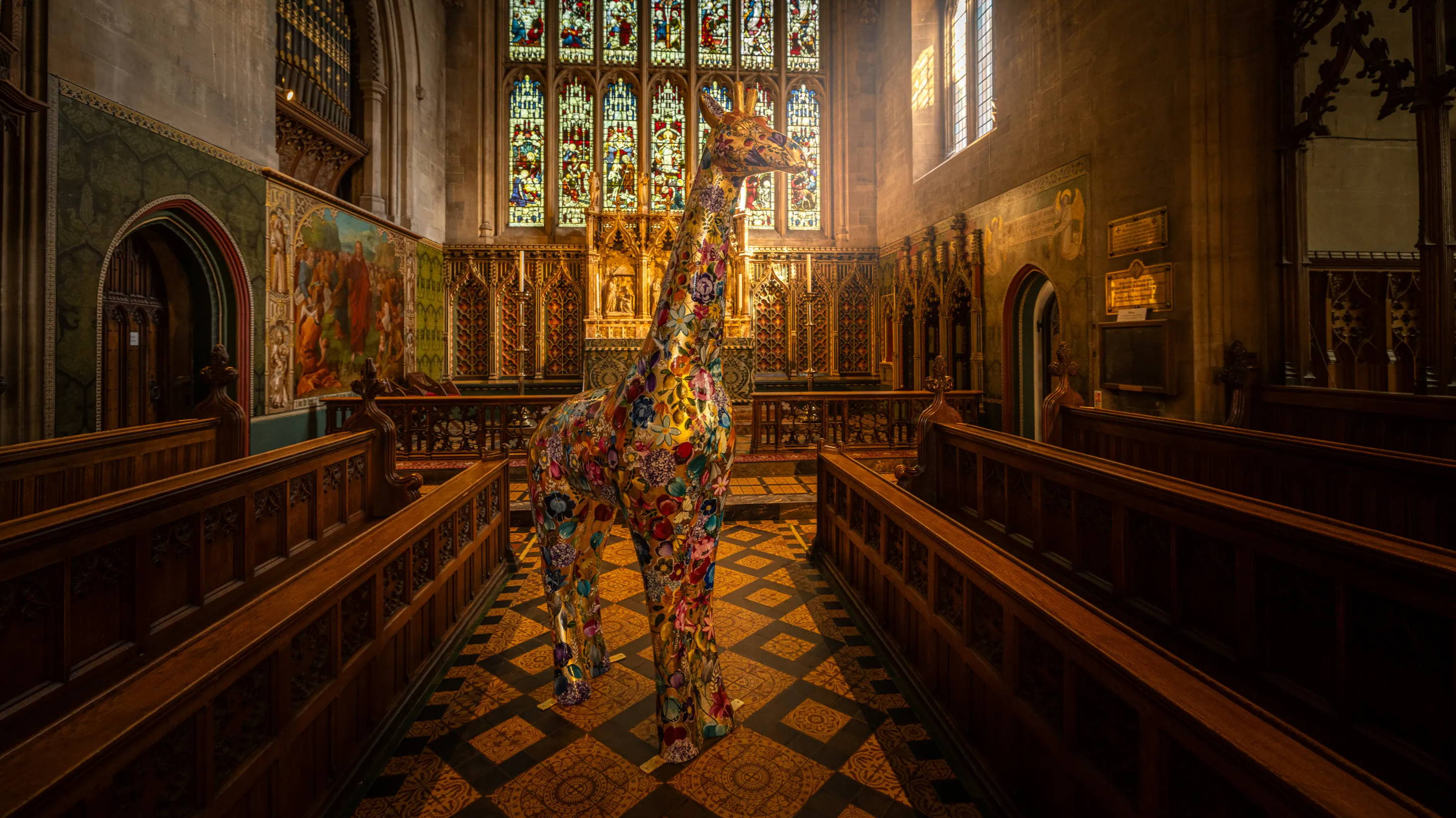 Becky Smith's golden floral giraffe sculpture artwork, Fleur, showcased in the Croydon Minister