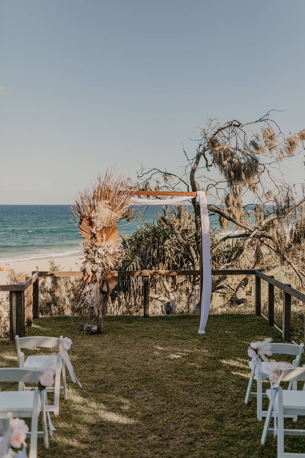 Beach wedding and wooden square shaped arbor