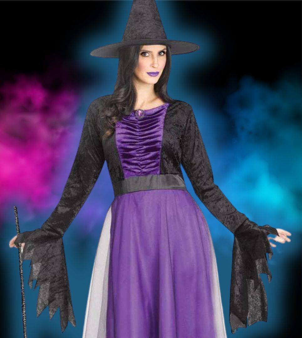 Woman in black and purple witch costume in front of blue and purple background. Shop witch costumes and accessories.