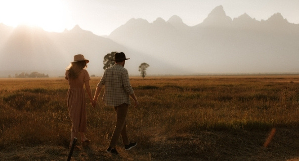 Erin and Conor walking while holding hands