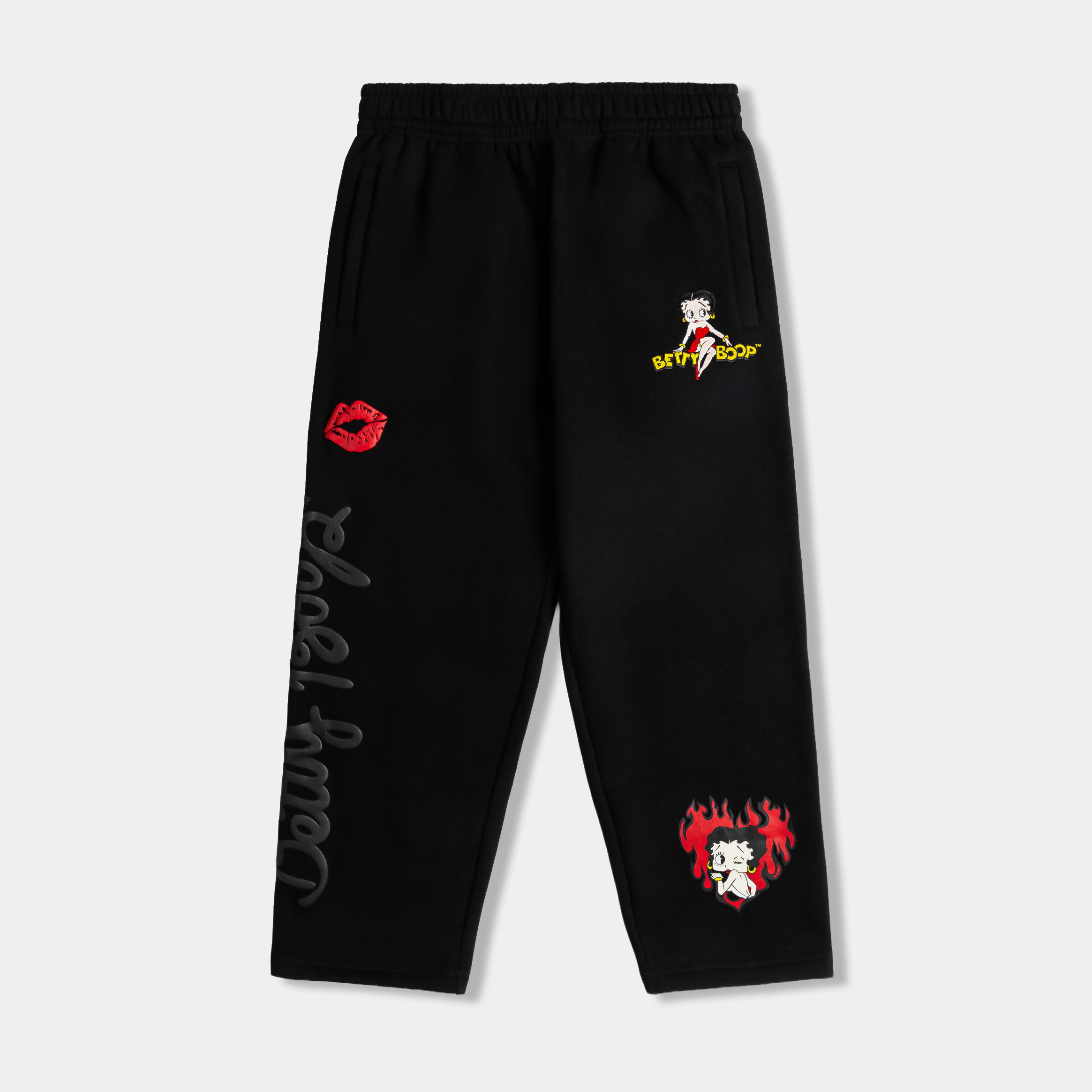 Black pants with colorful graphic designs and text.