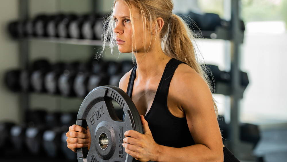 woman holding heavy weights