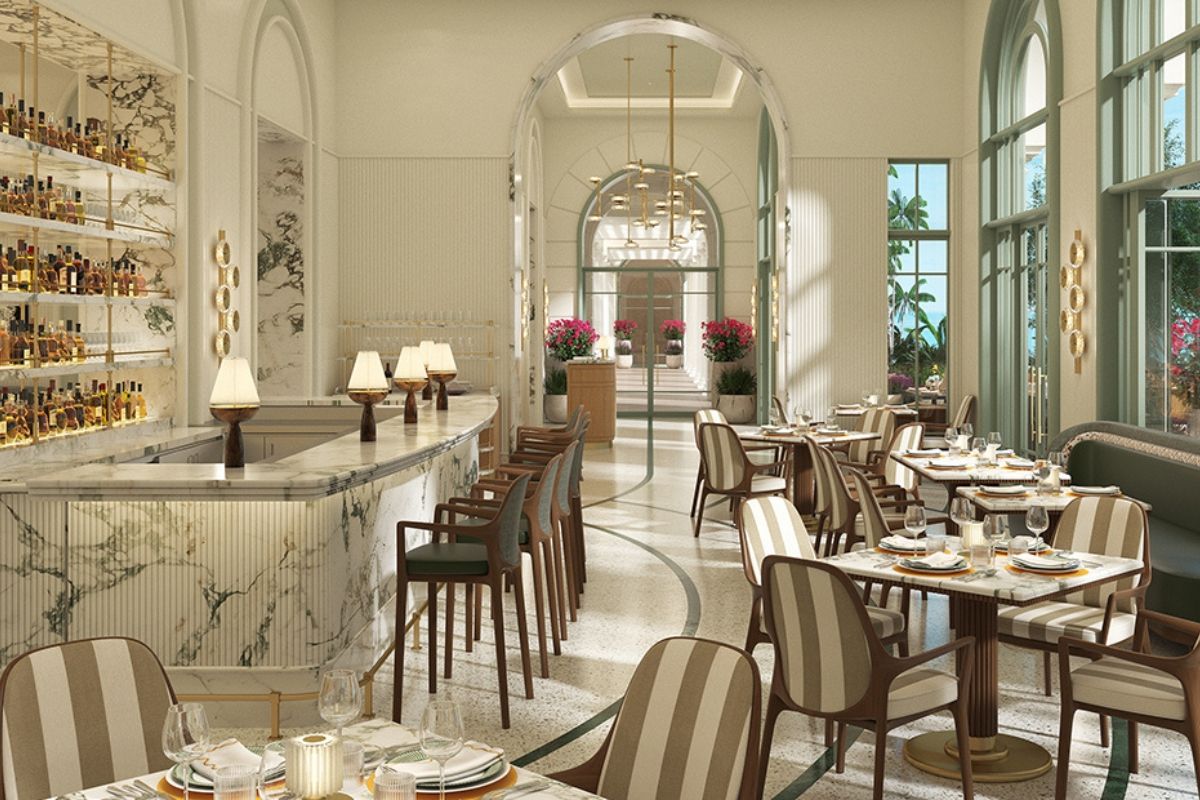 Elegant restaurant interior with marble bar and stylish seating arrangements.