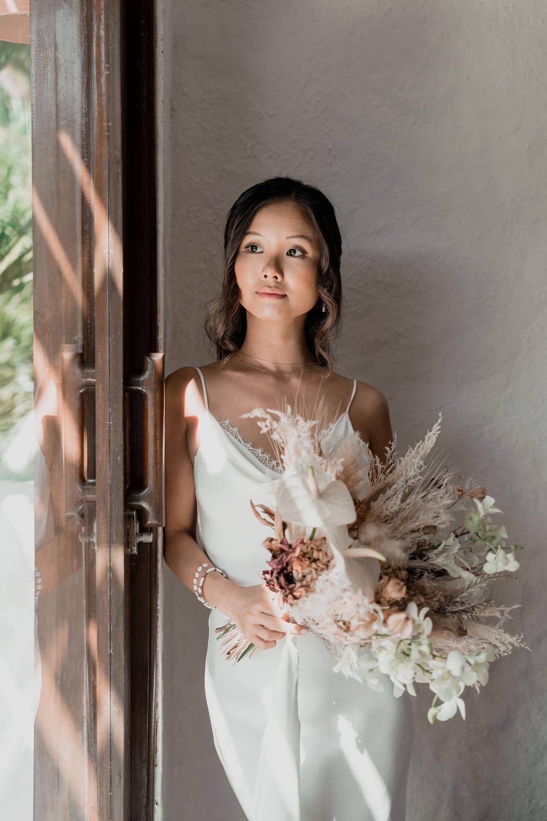 Bride, holding a boho bouquet