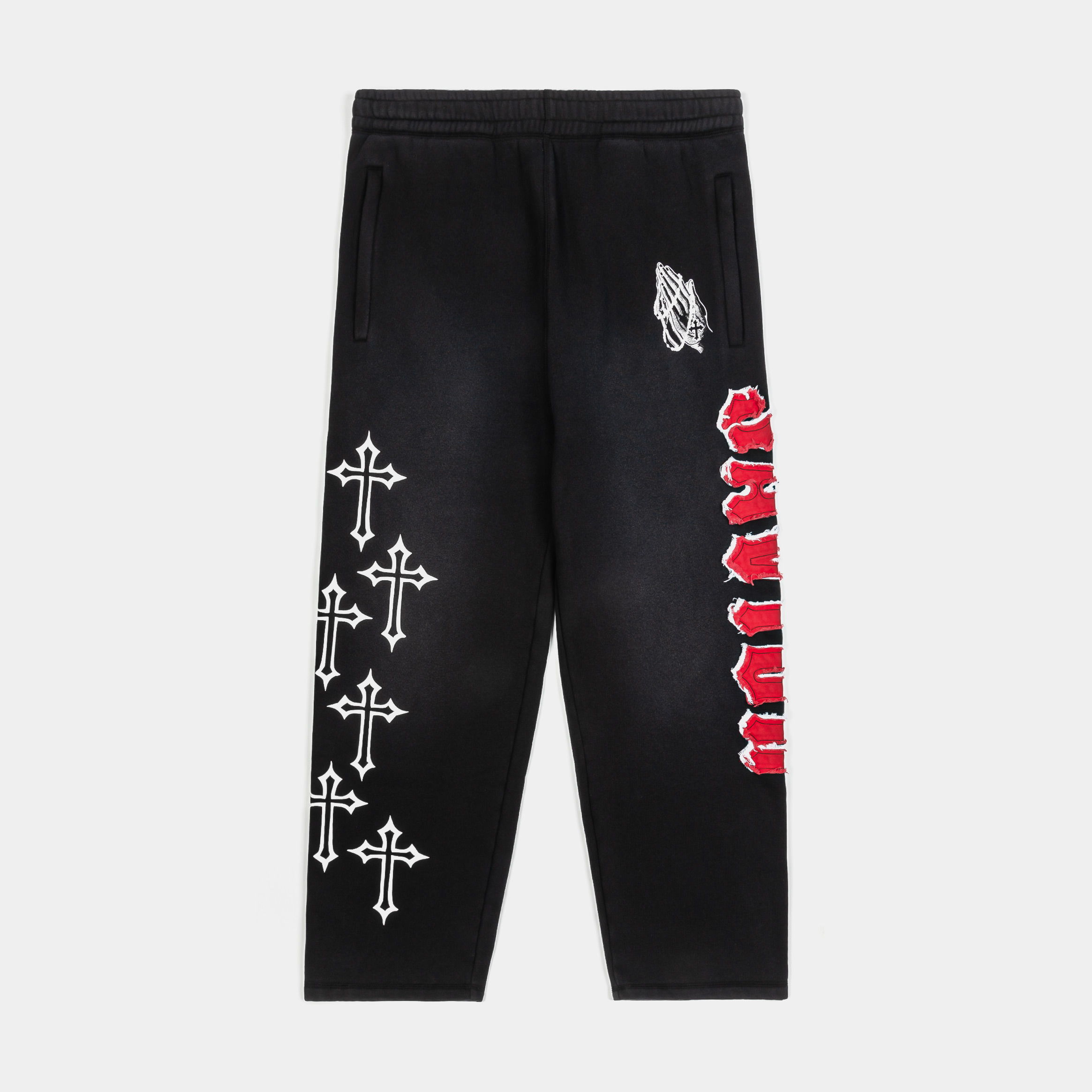 Black pants with white crosses and red text graphics.