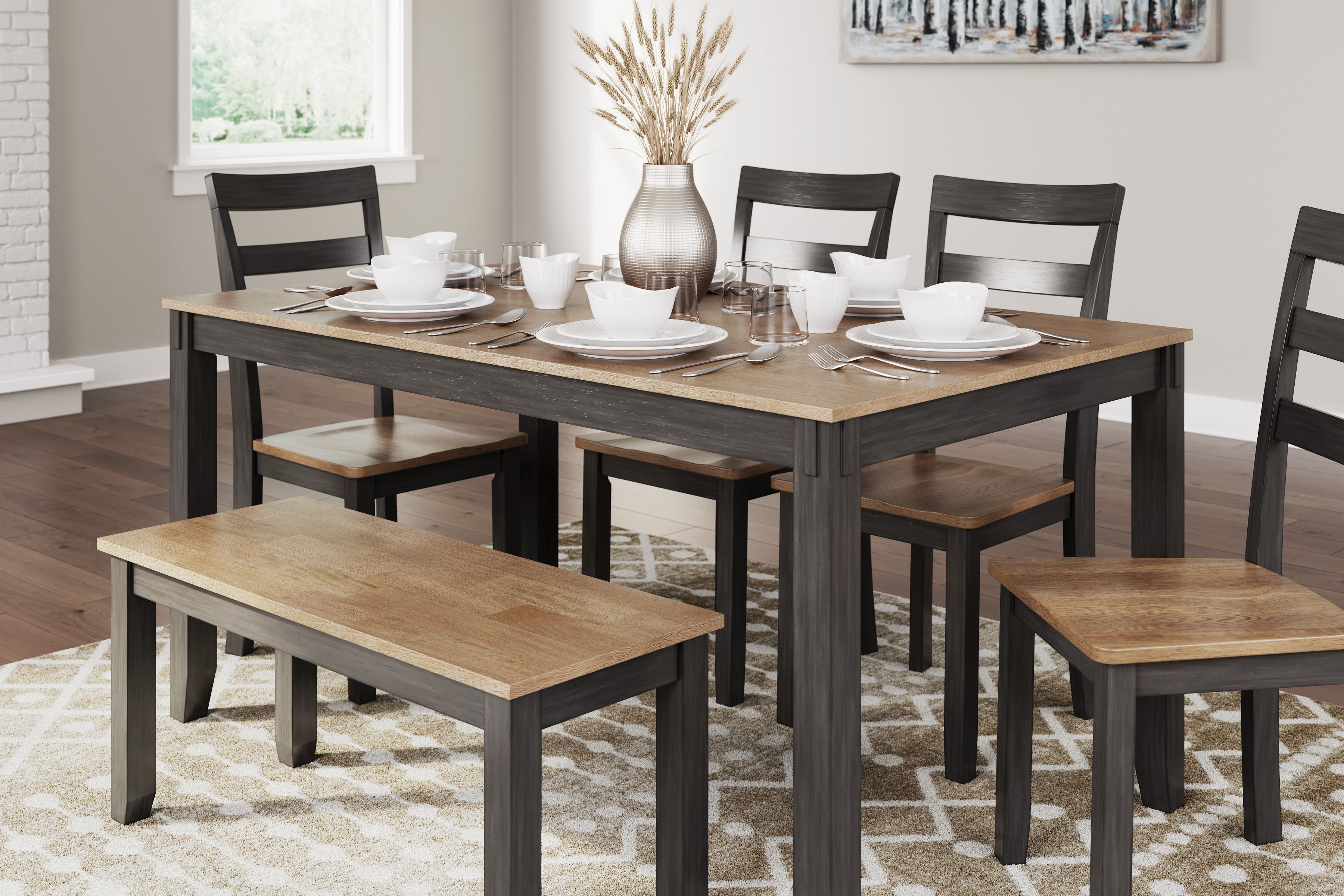 Dining table set with chairs, plates, and a vase in a cozy room.