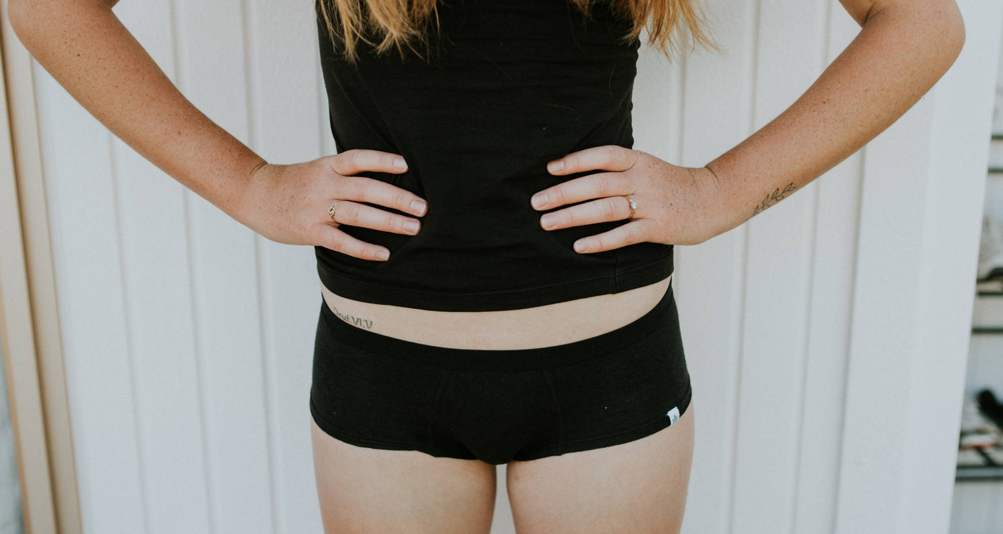 Woman wearing black boy shorts underwear knowing how to get rid of camel toe with WAMAs.
