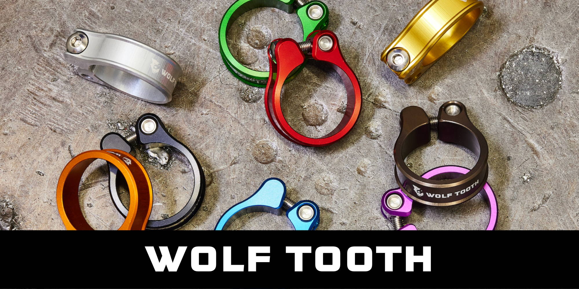 Wolf Tooth Bolt-Closure Seatpost Clamps in a variety of colors, including gold, green, silver, espresso, purple, blue, and orange.