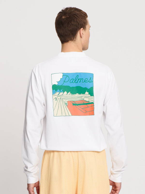 The back of a model wearing the Sunset long sleeve t shirt in white.