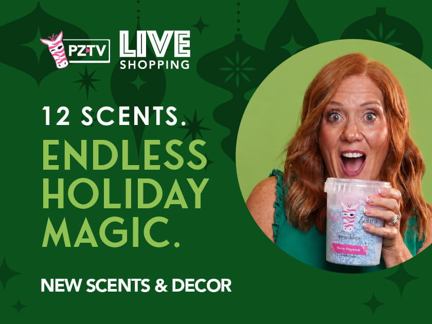 Woman smiling and holding a drink, promoting holiday scents and decor.