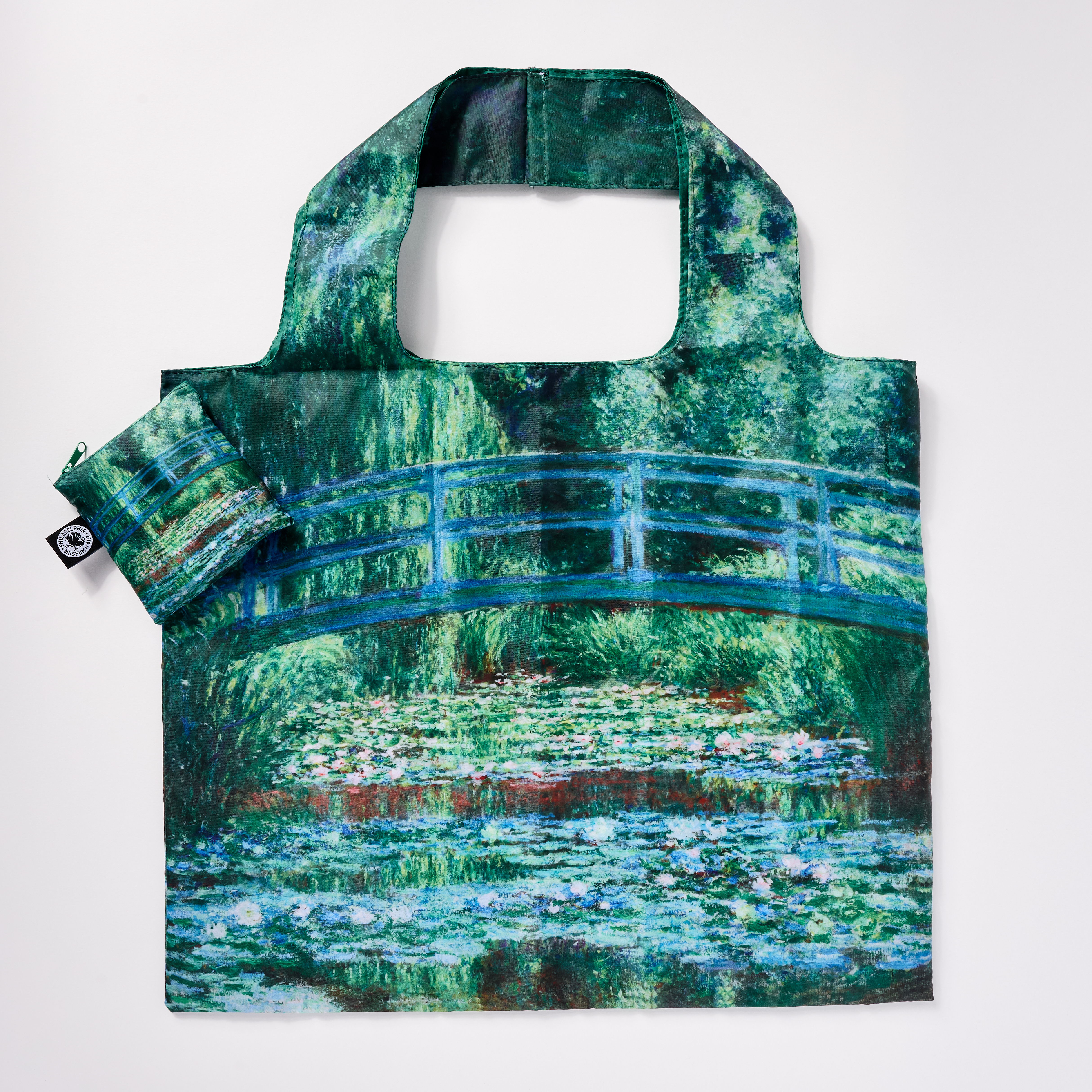 A reusable tote bag featuring a Monet-inspired water lily design.