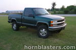 Front three-quarter Winston's green 1998 Chevy Silverado Z71 regular cab parked on grass photo 1