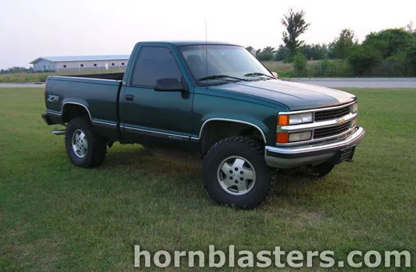 Front three-quarter Winston's green 1998 Chevy Silverado Z71 regular cab parked on grass photo 1